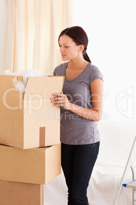 Woman packing a cardboard