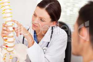 Female doctor showing patient a bone