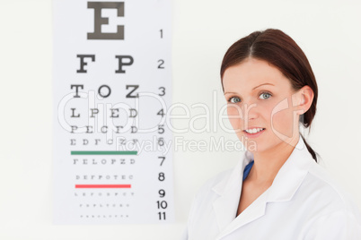 Female optician with eye test