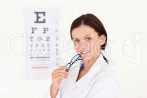 Kind female optician with an eye test