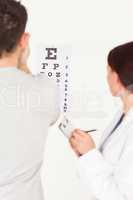 Female optician and patient in office