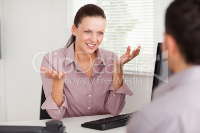 A businesswoman discussing with a customer
