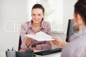 Businesswoman giving a customer a contract
