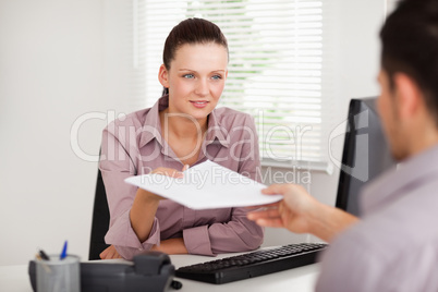 A businesswoman presenting a contract