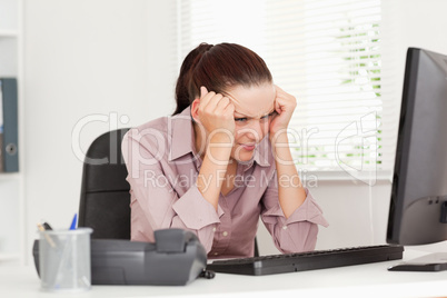 Frustrated businesswoman is office