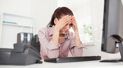 Frustrated businesswoman in office