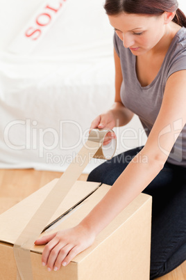 Woman preparing cardboard for transport