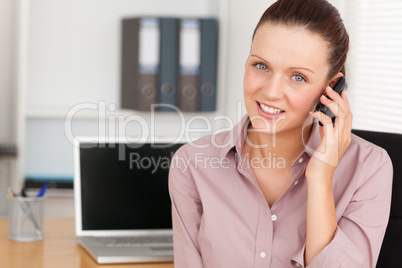 Beautiful businesswoman with a phone