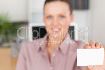 Businesswoman holding a card