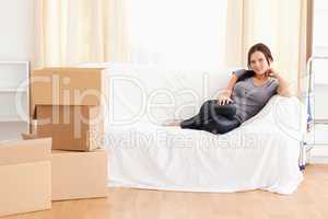 Cute woman sitting on a couch