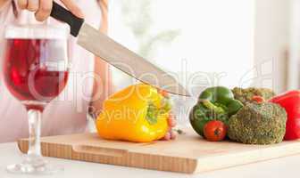Woman cutting a pepper