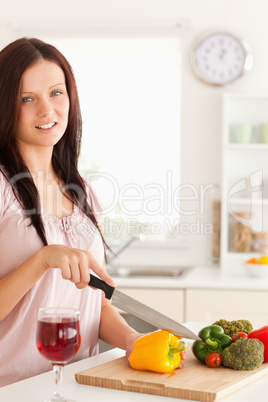 Portrait of a Smiling woman cutting vegetables