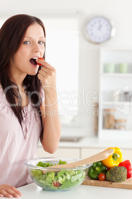 Portrait of a Cute woman eating vegetables