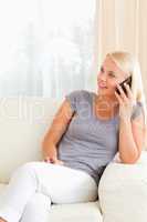 Portrait of a blonde woman on the phone