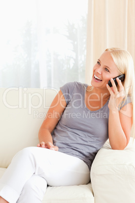 Portrait of a laughing woman on the phone