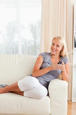 Portrait of a woman holding a mobile phone