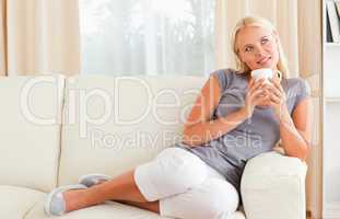 Woman holding a cup of coffee