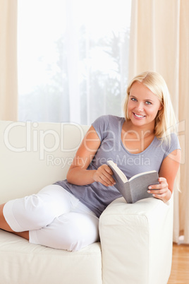 Portrait of a woman holding a book