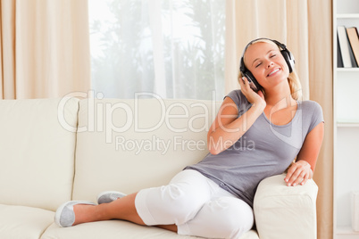 Pleased woman listening to music