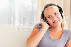 Close up of a smiling woman enjoying some music