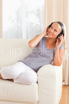 Portrait of a smiling woman enjoying some music