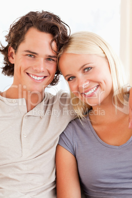 Portrait of a happy couple sitting on a sofa