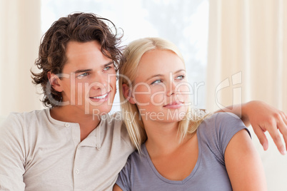 Young couple sitting on a sofa