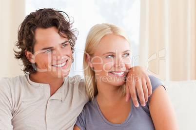 Cute couple sitting on a couch