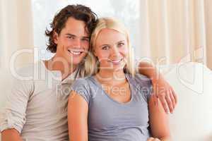 Young couple sitting on a couch