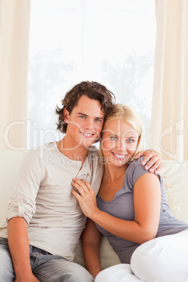 Portrait of a lovely couple sitting on a couch