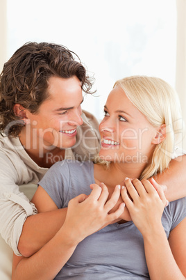 Portrait of a cute couple embracing each other