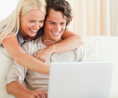 Couple using a laptop