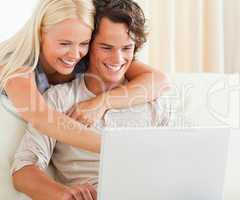 Couple using a laptop