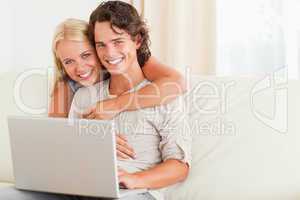 Happy couple with a notebook