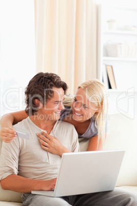 Portrait of a young couple buying online