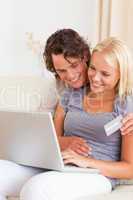 Portrait of a lovely couple shopping online