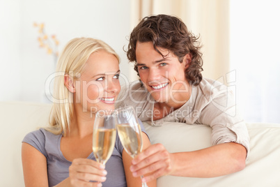 Beautiful couple making a toast