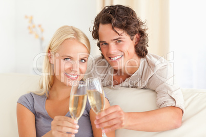 Lovely couple making a toast