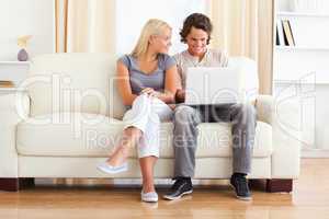 In love couple using a laptop
