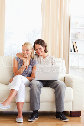 Portrait of a friendly couple with a notebook