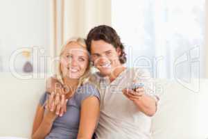 Young couple watching TV