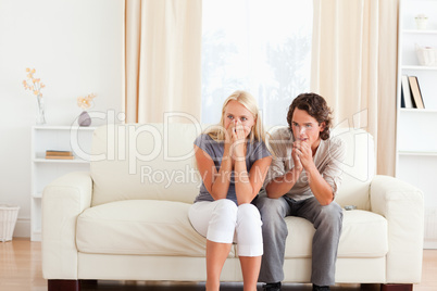 Couple watching a movie on TV