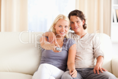 Lovely couple watching TV