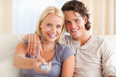 Close up of a cute couple watching TV