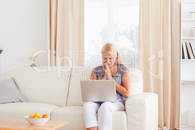 Worried woman using a laptop