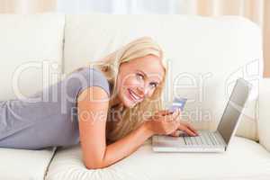 Smiling woman purchasing online