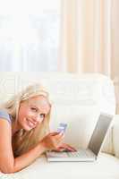 Portrait of a smiling woman purchasing online