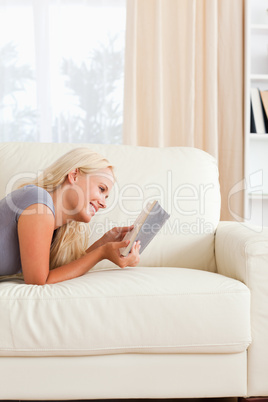 Portrait of a cute woman reading a book