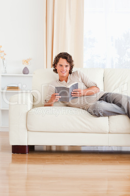 Portrait of a man holding a book