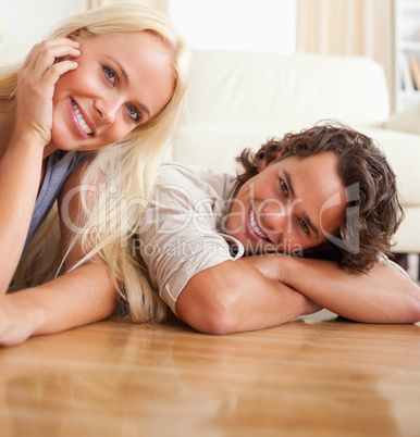 Close up of a couple lying on the floor